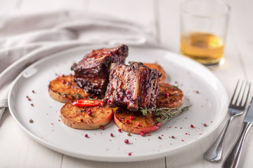 Hot Meat Dishes. Pork ribs grilled with peppers and apples