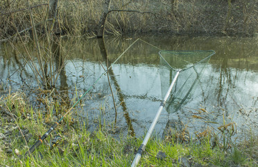 Fishing tackle on the river bank