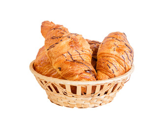 Delicious croissants in basket isolated on white background. Selective focus