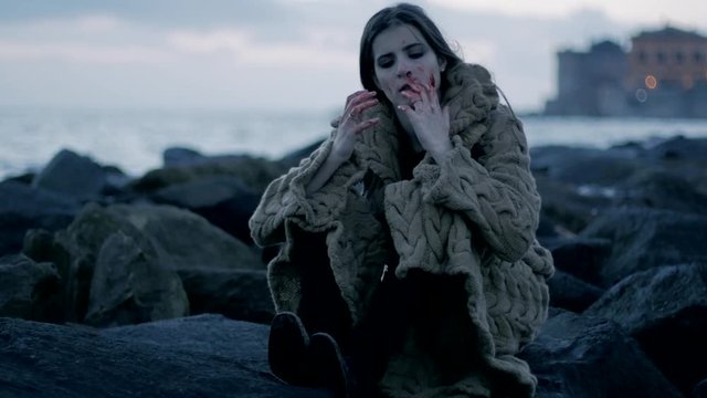 Crazy female serial killer looking blood