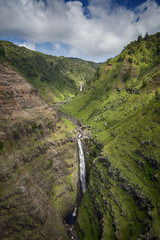 Fototapeta na wymiar Aerial view of waterfall in Waimea Canyon, Kauai, Hawaii