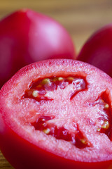 Closeup tomato on the wooden background