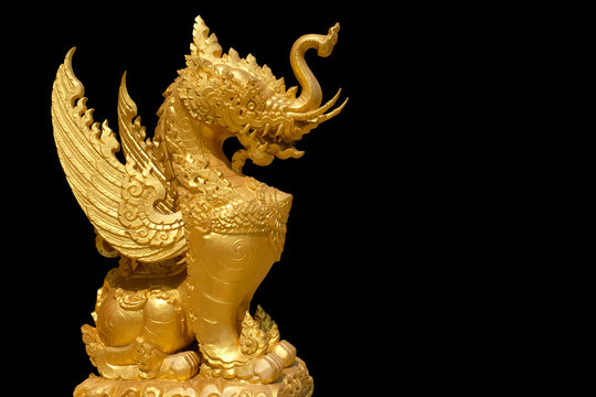 Golden monster, ancient golden monster statue or ancient golden monster image on black isolated