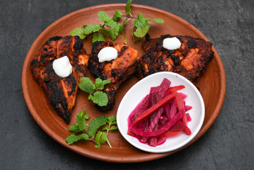 Arabian grilled chicken also called Al Faham or Alfaham or Djaj very popular recipe in Middle East. made using mix Bezar spices and barbeque in a charcoal grill or in oven.