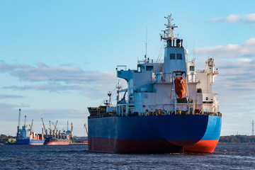 Fototapeta premium Blue cargo ship entering the port of Riga, Europe