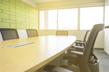 wooden table in meeting room with sound absorber sunlight from window