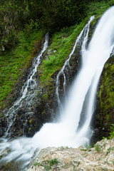 Naklejka premium Waterfall and small cascade in forests of Washington State