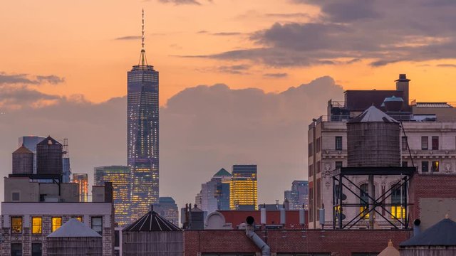USA, New York, Manhattan, Midtown, Freedom Tower over rooftops and water towers TIMELAPSE Day to Night