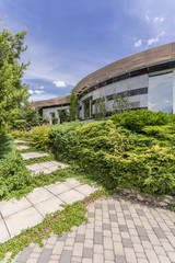 Modern housefront surrounded by plants