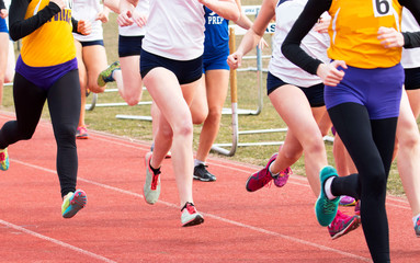 High School Girls racing on a track