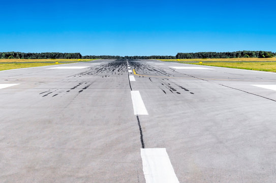 Runway at the airport and the blue sky conceptual aviation