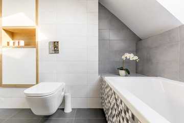 Attic bathroom with bathtub