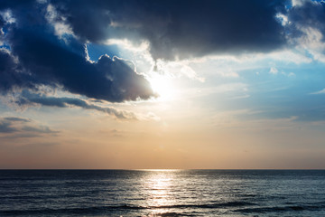sunset over ocean and clouds