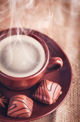 Cup fragrant hot coffee with bean chocolate sweet and loaf