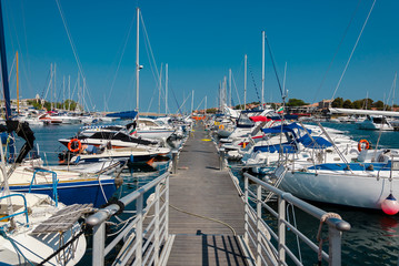 Fototapeta premium pier with moored boats in the port