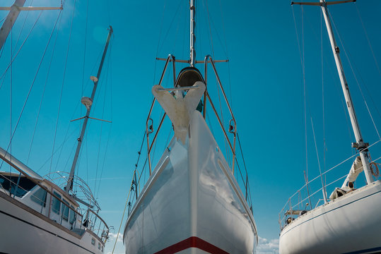 nose of white sailboat in the port