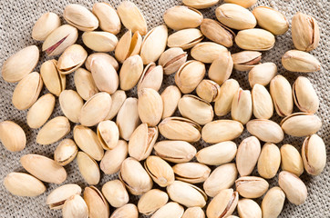 Top view of a lot of salty pistachios