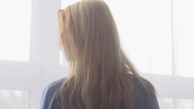 Pretty Young Woman in the seductive dressing gown. SLOW MOTION Stock Footage. Model: Eveline. 