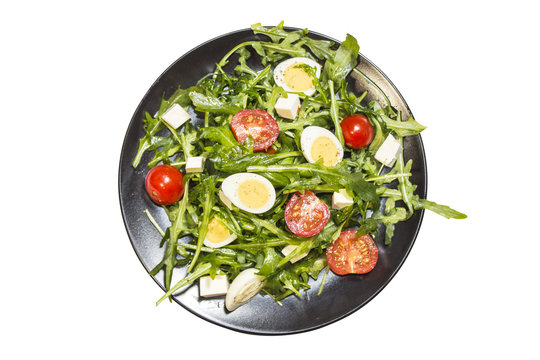 Quail eggs salad on a plate