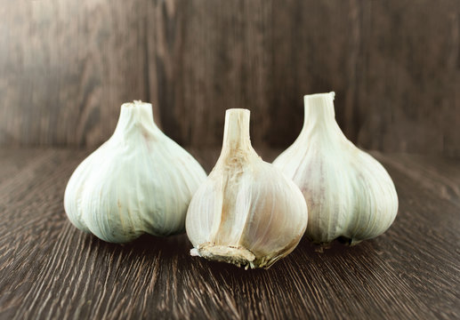 Group bulb Head of garlic on wood background with shadow
