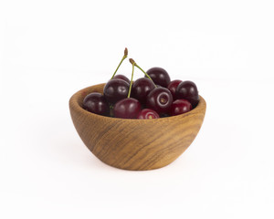 Bowl with cherries isolated on white background. Ripe cherry close-up. Background berry. Sweet and juicy berry with copy space for text.