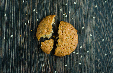 tasty biscuits on cereal on wood background