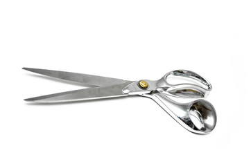 Obraz premium Pair of tailor scissors with metal golden handle isolated on white background.