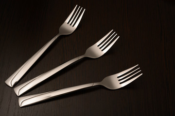 Three metal forks