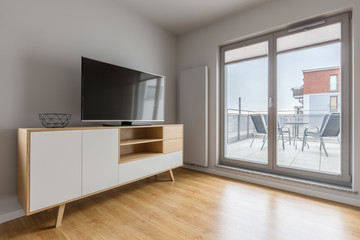 Tv living room with balcony