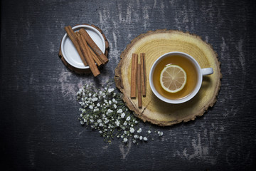Food background with different black and green dry tea, rose buds cup of hot tea