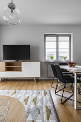 Grey living room with table