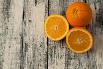 Orange fruit cut and orange juice on wooden table background,