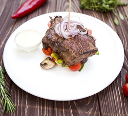 Meat with rosemary and cherry tomatoes