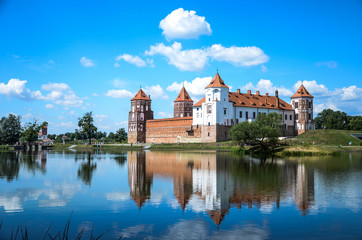 Naklejka na ściany i meble Mir castle in Belarus. The tour of the castle on a summer day