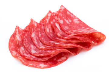 Salami smoked sausage slices isolated on white background cutout.
