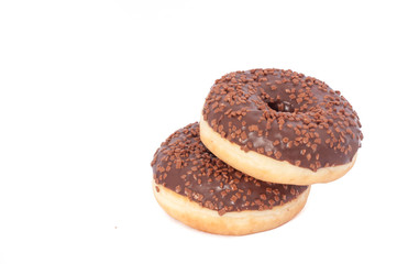 Two Chocolate Donuts with Sprinkles. Isolated on a White Background
