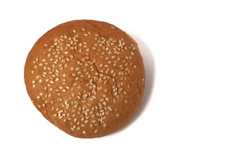 Hamburger bun with sesame seeds isolated on a white background