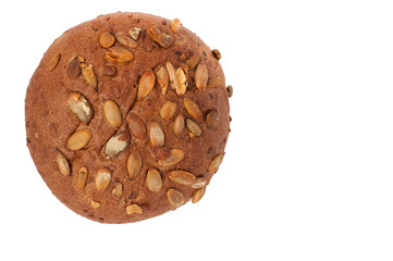 round a bun with pumpkin seeds isolated on a white background