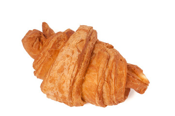 Fresh and tasty croissant over isolated white background
