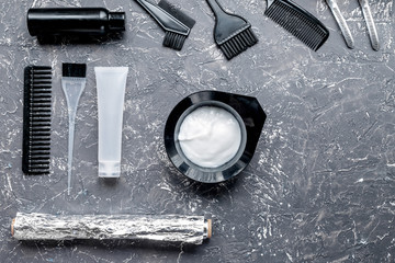 hair care concept with dye tools on gray background top view mockup