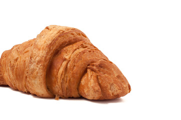 Fresh and tasty croissant over isolated white background