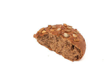 round a bun with pumpkin seeds wherein is isolated on a white background