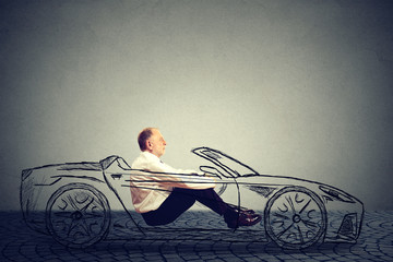 Self driving technology concept. Side profile senior man inside autonomous car