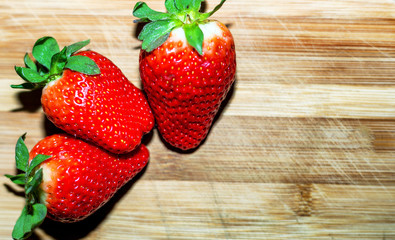 Fresh strawberry on wooden tray