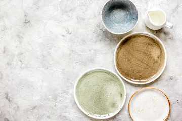 ceramic tableware top view on stone background mock up