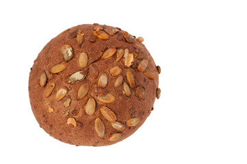 round a bun with pumpkin seeds isolated on a white background