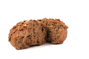 round a bun with pumpkin seeds wherein is isolated on a white background