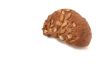round a bun with pumpkin seeds wherein is isolated on a white background