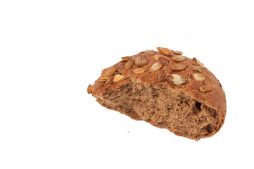 round a bun with pumpkin seeds wherein is isolated on a white background