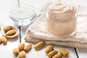 spa concept with almond nuts on wooden background